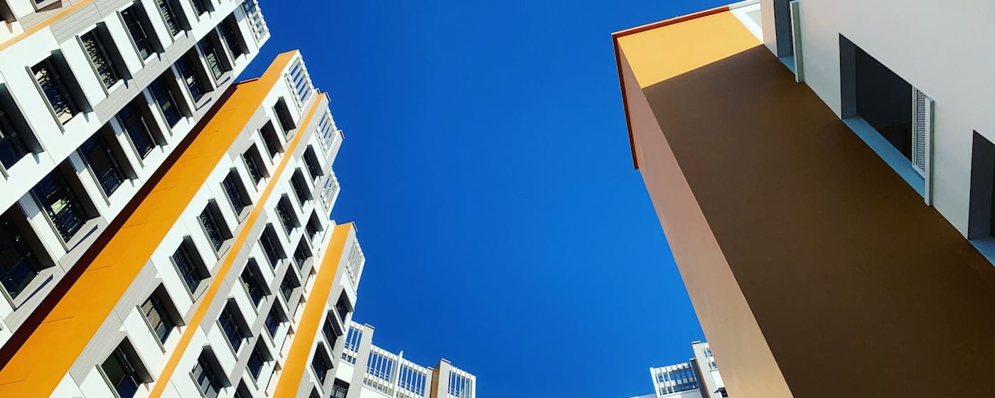 Soft morning light over Compassvale housing blocks