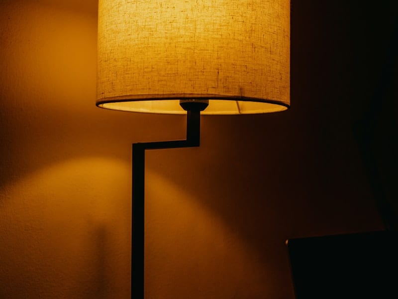 Desk lamp glow in a dark room